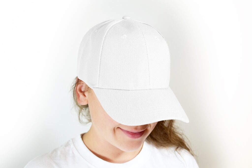 Closeup mockup photo of a woman wearing a white cap hat